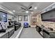 Finished basement with a large entertainment area and comfortable leather seating for movie nights at 2640 Paddock Point Pl, Dacula, GA 30019