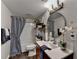 Cozy bathroom features a shower-tub combo and vanity with modern fixtures at 2640 Paddock Point Pl, Dacula, GA 30019