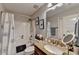 Bathroom features a granite vanity, framed mirror and shower/tub combo at 2640 Paddock Point Pl, Dacula, GA 30019