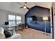 Bedroom with a study area featuring a desk, TV, guitar and neutral carpeting at 2640 Paddock Point Pl, Dacula, GA 30019