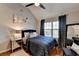 Bedroom with hardwood flooring, a large window, and elegant decor, including a mirrored nightstand at 2640 Paddock Point Pl, Dacula, GA 30019