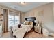 Serene bedroom with neutral tones, plush bedding, stylish decor, and a sunlit window at 2640 Paddock Point Pl, Dacula, GA 30019