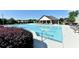 Resort-style pool with lounge chairs and clubhouse for relaxing summer days at 2640 Paddock Point Pl, Dacula, GA 30019