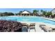 A refreshing community pool with inviting lounge chairs and an elegant clubhouse at 2640 Paddock Point Pl, Dacula, GA 30019