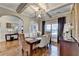 Elegant dining room featuring hardwood floors, stylish light fixture, and sophisticated decor at 2640 Paddock Point Pl, Dacula, GA 30019