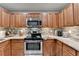 Kitchen boasts stainless steel appliances, granite countertops, and a tiled backsplash at 2640 Paddock Point Pl, Dacula, GA 30019