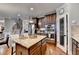 Spacious kitchen island, stainless appliances, pantry, and hardwood floors create a functional and elegant cooking space at 2640 Paddock Point Pl, Dacula, GA 30019