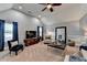Inviting living room with vaulted ceiling, large windows and neutral tones at 2640 Paddock Point Pl, Dacula, GA 30019