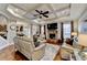 Spacious living room featuring hardwood floors, coffered ceilings, and a stone fireplace at 2640 Paddock Point Pl, Dacula, GA 30019