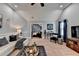 Bright living room with plush carpet, vaulted ceilings, and elegant furniture arrangement at 2640 Paddock Point Pl, Dacula, GA 30019
