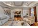 Bright living room with hardwood floors, staircase, and an open layout at 2640 Paddock Point Pl, Dacula, GA 30019