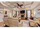 Cozy living room with hardwood floors, a stone fireplace, and comfortable seating at 2640 Paddock Point Pl, Dacula, GA 30019