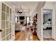 Open-concept living room with coffered ceilings and a cozy fireplace at 2640 Paddock Point Pl, Dacula, GA 30019