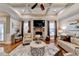 Bright living room with a stone fireplace and coffered ceilings at 2640 Paddock Point Pl, Dacula, GA 30019