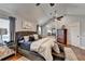 Main bedroom showcasing hardwood floors, seating area and ceiling fan at 2640 Paddock Point Pl, Dacula, GA 30019