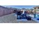 Cozy patio with a grill, outdoor seating, and a rustic stone ground cover, perfect for entertaining at 2640 Paddock Point Pl, Dacula, GA 30019