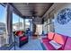 The screened-in porch offers a peaceful spot with comfortable wicker seating and a ceiling fan at 2640 Paddock Point Pl, Dacula, GA 30019
