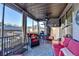 Inviting screened-in porch provides a cozy outdoor living space with comfortable seating at 2640 Paddock Point Pl, Dacula, GA 30019