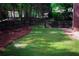 Spacious backyard with lush green grass, perfect for outdoor activities at 350 Newcastle Dr, Alpharetta, GA 30009