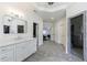 Open concept bathroom includes walk-in closets, dual sink vanity, and a glass enclosed shower at 350 Newcastle Dr, Alpharetta, GA 30009
