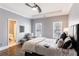 Neutral bedroom featuring hardwood floors, ample natural light, and an en-suite bathroom at 350 Newcastle Dr, Alpharetta, GA 30009