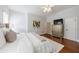 Bright bedroom featuring hardwood floors and a mirrored dresser at 350 Newcastle Dr, Alpharetta, GA 30009