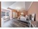 Bright bedroom with modern decor, plenty of natural light, and wood-look floors at 350 Newcastle Dr, Alpharetta, GA 30009