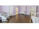 Bright Bedroom featuring hardwood floors and lavender walls at 350 Newcastle Dr, Alpharetta, GA 30009