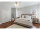 Inviting bedroom with neutral tones, plush carpet, ceiling fan, and bright windows at 350 Newcastle Dr, Alpharetta, GA 30009