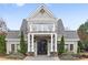 Community clubhouse with stone accents, manicured landscaping, and a welcoming entrance at 350 Newcastle Dr, Alpharetta, GA 30009
