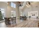 Spacious common room with tall ceilings, hardwood floors, and large windows offering natural light at 350 Newcastle Dr, Alpharetta, GA 30009