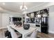 Elegant dining area with wet bar, modern lighting, stylish furniture and appliances at 350 Newcastle Dr, Alpharetta, GA 30009