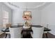 Dining room with hardwood floors, white trim, and a modern chandelier at 350 Newcastle Dr, Alpharetta, GA 30009