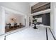 Elegant foyer with soaring ceilings, black accent wall and marble flooring at 350 Newcastle Dr, Alpharetta, GA 30009