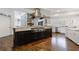 Gourmet kitchen featuring stainless steel appliances, a large island, and custom cabinets at 350 Newcastle Dr, Alpharetta, GA 30009