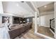 Spacious living room with sleek gray color palette, fireplace, and wood-look flooring at 350 Newcastle Dr, Alpharetta, GA 30009