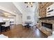 Spacious living room featuring a stone fireplace and an open floorplan at 350 Newcastle Dr, Alpharetta, GA 30009