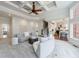Bright living room with coffered ceiling, fireplace, and open floor plan to kitchen at 350 Newcastle Dr, Alpharetta, GA 30009