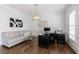 Bright home office featuring hardwood floors, a large desk and a comfortable sofa at 350 Newcastle Dr, Alpharetta, GA 30009