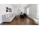 Bright home office featuring hardwood floors, a large desk and a comfortable sofa at 350 Newcastle Dr, Alpharetta, GA 30009