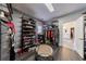 Walk-in closet features shelving for shoes and clothes, with a view to the bathroom at 350 Newcastle Dr, Alpharetta, GA 30009