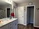 Bathroom with double vanity, framed mirrors, and grey walls at 101 Waters Edge Pkwy, Temple, GA 30179