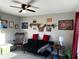 Bedroom featuring a futon, rocking chair, ceiling fan, and decor at 101 Waters Edge Pkwy, Temple, GA 30179