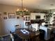 Kitchen with white cabinets, stainless steel appliances and an adjacent dining area at 101 Waters Edge Pkwy, Temple, GA 30179