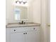 Bathroom featuring vanity with granite countertop and modern faucet at 1316 Milstead Ave, Conyers, GA 30012