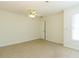 Inviting bedroom featuring neutral carpeting, a ceiling fan and natural light at 1316 Milstead Ave, Conyers, GA 30012