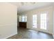 Bright dining area featuring tile flooring, patio access and built-in cabinets for extra storage at 1316 Milstead Ave, Conyers, GA 30012