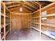 Shed interior featuring multiple shelves for organized storage and a functional workspace at 1316 Milstead Ave, Conyers, GA 30012