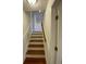 Traditional staircase with hardwood treads and white risers, leading to upper levels of home at 1316 Milstead Ave, Conyers, GA 30012