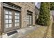 Back of the house featuring two entrance doors on a brick exterior with some greenery at 4820 Marina Ln, Mableton, GA 30126